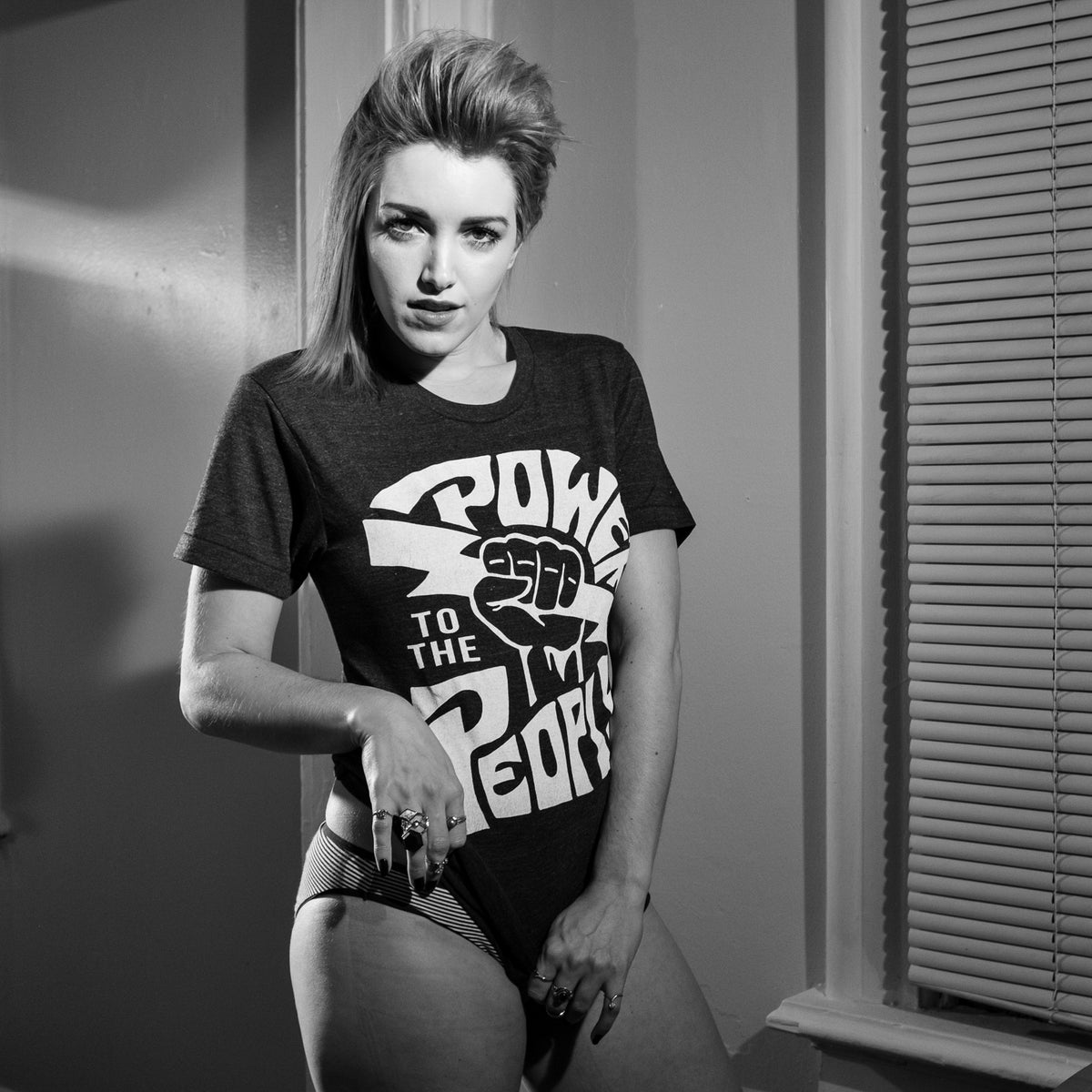 Power To The People Rock Tee Mysterioso Rock Art Model Wearing Black T-Shirt, white Print Bobbi Kitten Damn The Witch Siren Chip Willis Black and White Photo